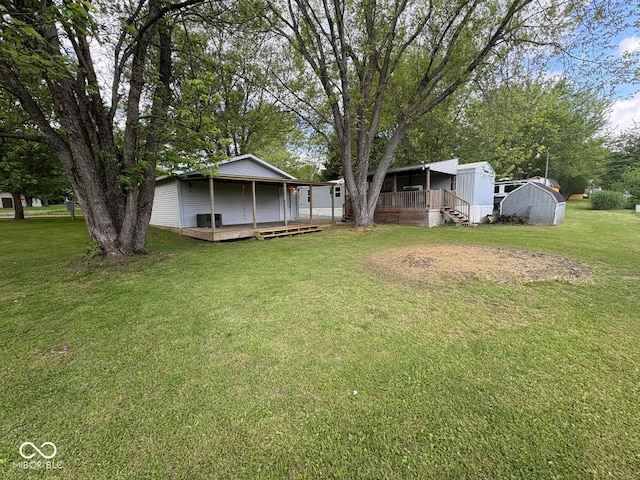 15003 Pheasant Dr, Brookville, IN 47012 - view of green lawn featuring a deck