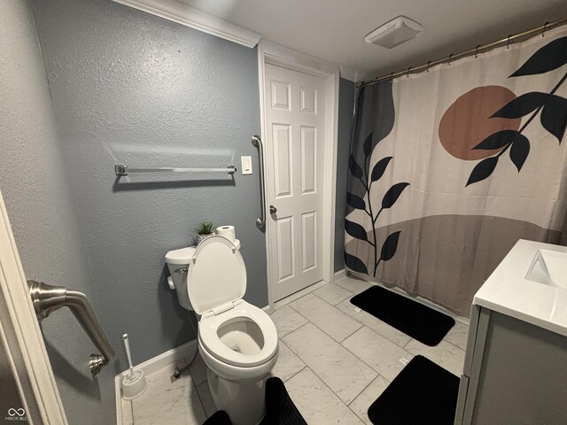 3041 S Rybolt Ave, Indianapolis, IN 46241 - full bath with marble look tiles, baseboards, toilet, vanity, and a shower with curtain