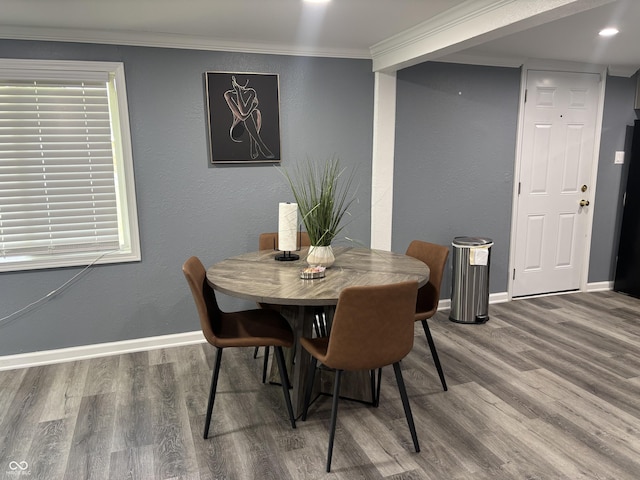 3041 S Rybolt Ave, Indianapolis, IN 46241 - dining room with wood finished floors, baseboards, and crown molding