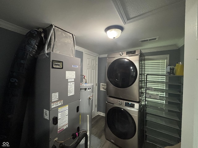 3041 S Rybolt Ave, Indianapolis, IN 46241 - laundry room featuring estacked washer and dryer, crown molding, wood finished floors, water heater, and heating unit