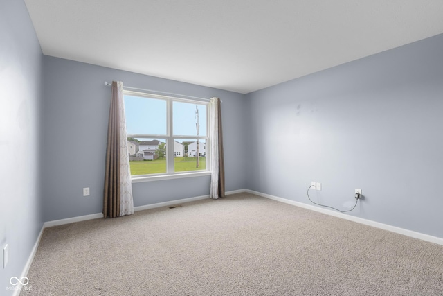 2502 Creekland Dr, Columbus, IN 47201 - carpeted spare room with baseboards