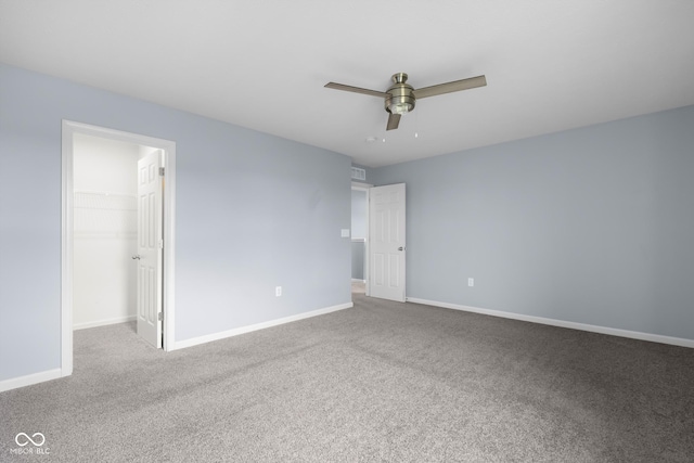 2502 Creekland Dr, Columbus, IN 47201 - unfurnished bedroom with carpet floors, a spacious closet, baseboards, and a closet