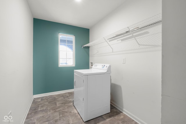 2502 Creekland Dr, Columbus, IN 47201 - laundry area with washer / clothes dryer, baseboards, and stone finish flooring