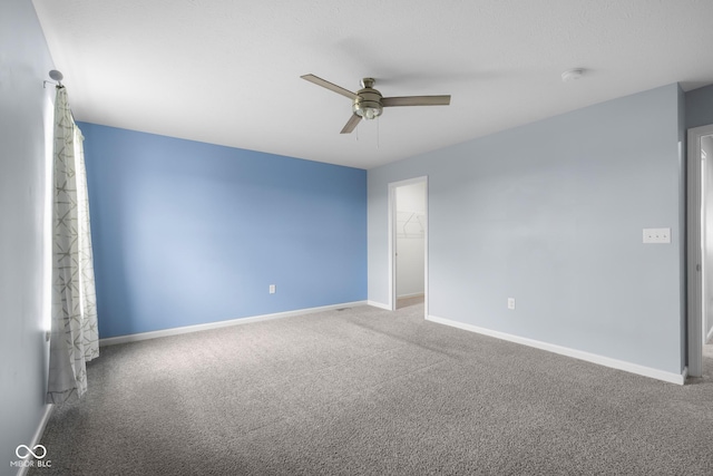 2502 Creekland Dr, Columbus, IN 47201 - spare room featuring ceiling fan, carpet flooring, and baseboards