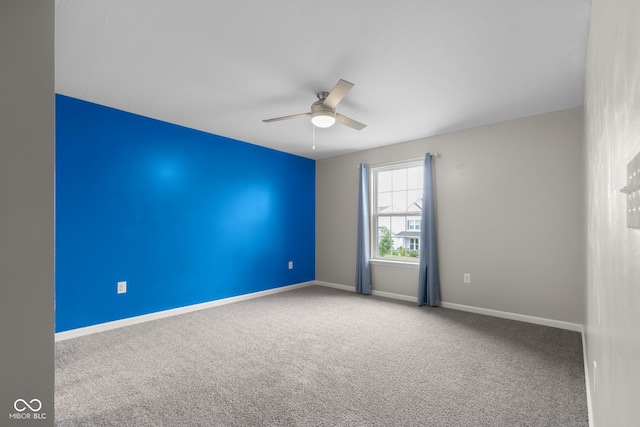 2502 Creekland Dr, Columbus, IN 47201 - empty room featuring ceiling fan, carpet floors, and baseboards