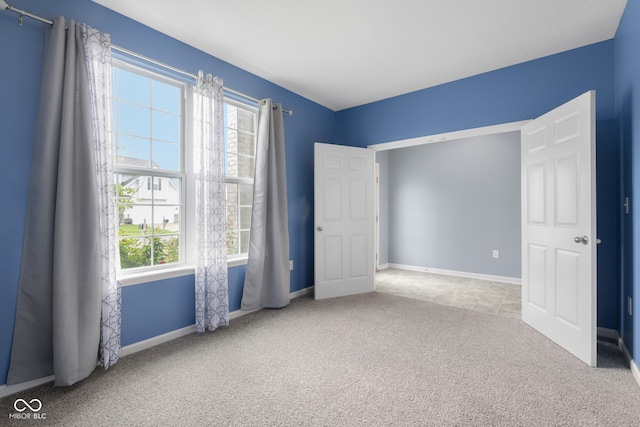 2502 Creekland Dr, Columbus, IN 47201 - unfurnished bedroom featuring carpet and baseboards