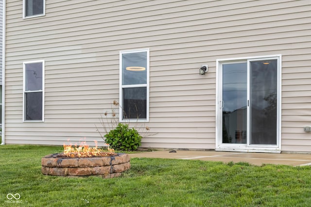 2502 Creekland Dr, Columbus, IN 47201 - view of side of property featuring a yard and an outdoor fire pit