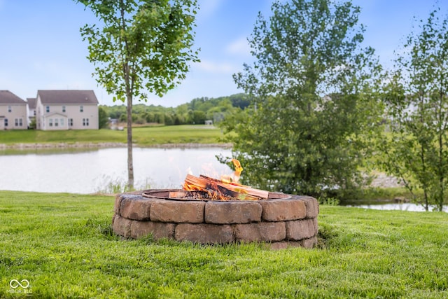 2502 Creekland Dr, Columbus, IN 47201 - view of green lawn with a water view and a fire pit