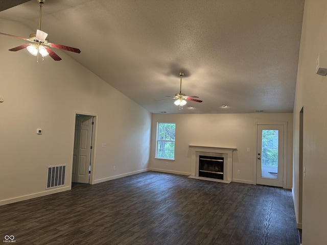 1009 Springwater Rd, Kokomo, IN 46902 - unfurnished living room featuring ceiling fan, dark wood-style floors, a fireplace with flush hearth, baseboards, and high vaulted ceiling