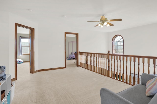 545 Walnut Woods Dr, Greenwood, IN 46142 - sitting room featuring ceiling fan, plenty of natural light, carpet floors, and baseboards