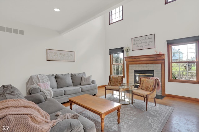 545 Walnut Woods Dr, Greenwood, IN 46142 - living area with baseboards, a high ceiling, a fireplace, wood finished floors, and recessed lighting