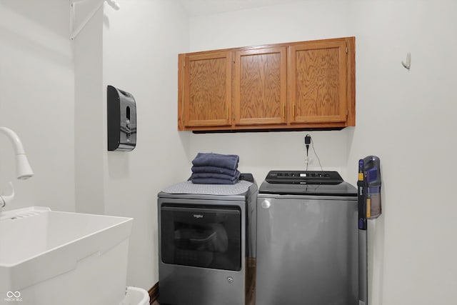 545 Walnut Woods Dr, Greenwood, IN 46142 - laundry area with cabinet space and washing machine and clothes dryer