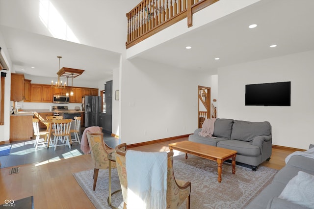 545 Walnut Woods Dr, Greenwood, IN 46142 - living room with light wood-style flooring, recessed lighting, and baseboards