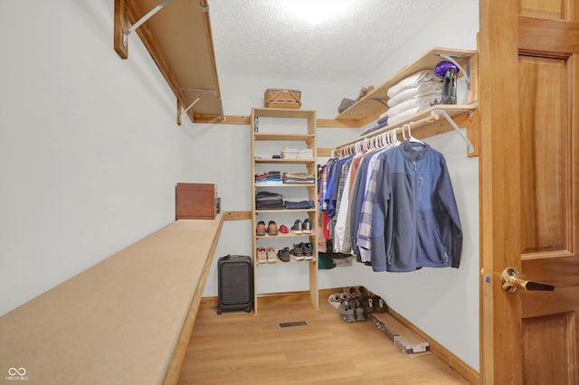 545 Walnut Woods Dr, Greenwood, IN 46142 - spacious closet featuring wood finished floors
