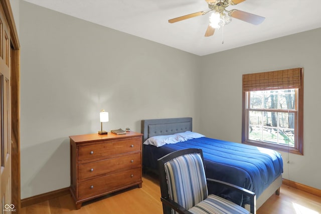 545 Walnut Woods Dr, Greenwood, IN 46142 - bedroom featuring light wood-style flooring, baseboards, and ceiling fan