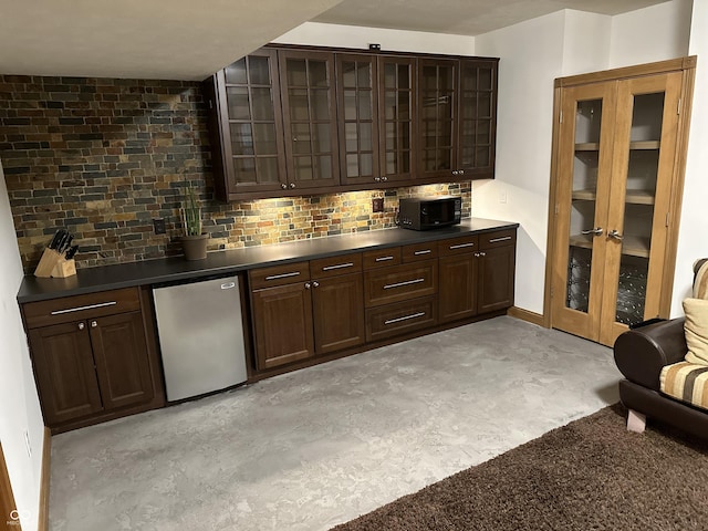 545 Walnut Woods Dr, Greenwood, IN 46142 - bar area featuring refrigerator, backsplash, and black microwave