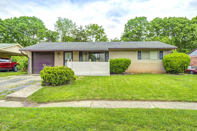 5558 Bertha St, Indianapolis, IN 46241 - ranch-style house featuring a front lawn, asphalt driveway, a shingled roof, and an attached garage
