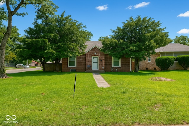 3602 N Colorado Ave, Indianapolis, IN 46218 - view of property hidden behind natural elements with brick siding, a front yard, and crawl space