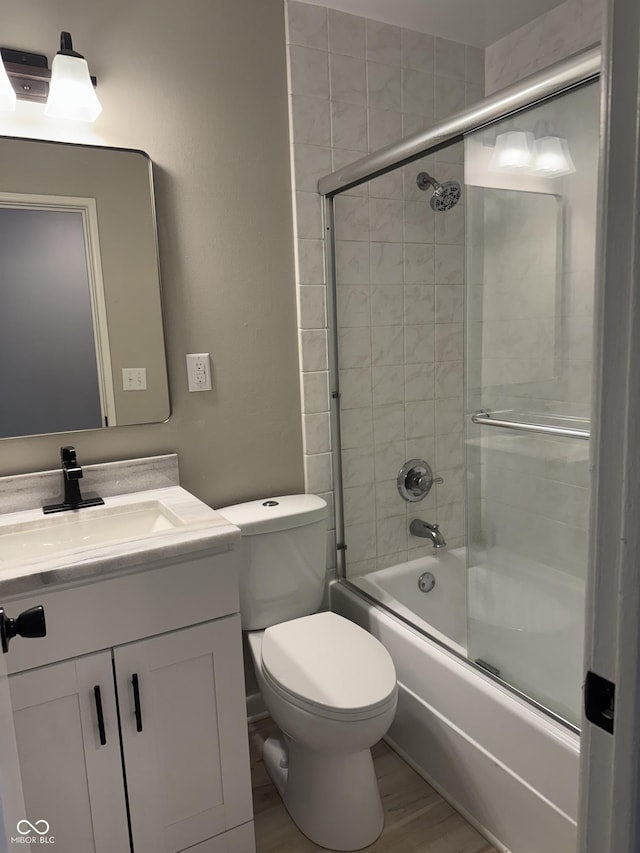 10328 Central Ave, Carmel, IN 46280 - bathroom featuring vanity, shower / bath combination with glass door, and toilet