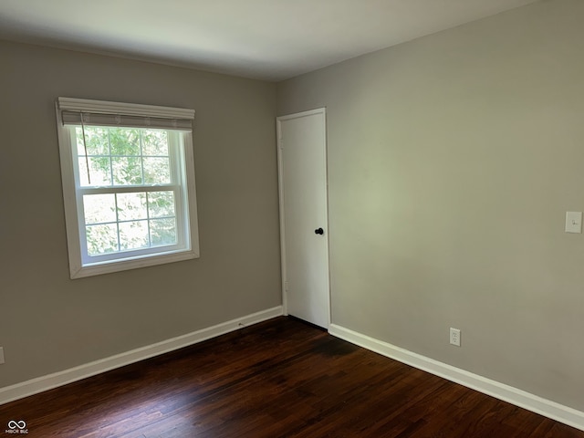 10328 Central Ave, Carmel, IN 46280 - unfurnished room with dark wood-style flooring and baseboards
