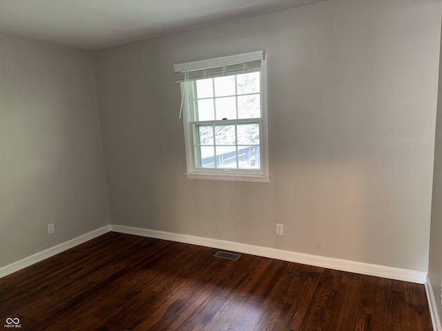 10328 Central Ave, Carmel, IN 46280 - unfurnished room with baseboards and dark wood-style floors