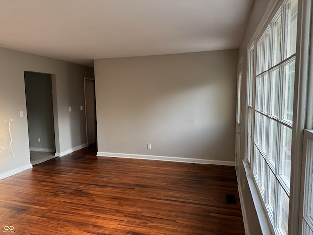 10328 Central Ave, Carmel, IN 46280 - empty room featuring dark wood finished floors and baseboards