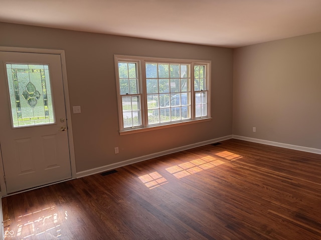 10328 Central Ave, Carmel, IN 46280 - entryway with baseboards and dark wood finished floors
