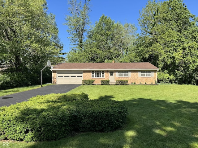 10328 Central Ave, Carmel, IN 46280 - view of front facade with a garage, driveway, a front lawn, and brick siding