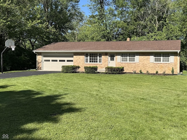 10328 Central Ave, Carmel, IN 46280 - single story home with an attached garage, a front yard, asphalt driveway, and brick siding