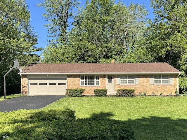 10328 Central Ave, Carmel, IN 46280 - ranch-style house with driveway, brick siding, and a front yard