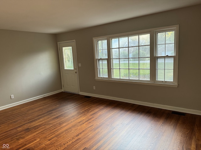10328 Central Ave, Carmel, IN 46280 - foyer entrance featuring dark wood-type flooring and baseboards
