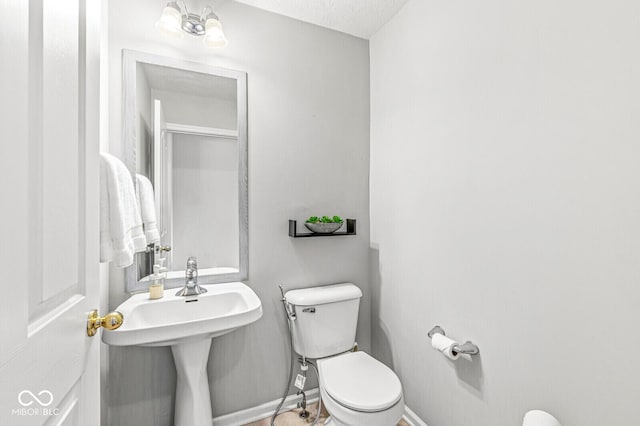 14353 Chariots Whisper Dr, Carmel, IN 46074 - half bathroom featuring toilet and baseboards