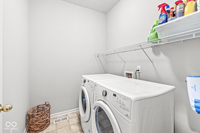14353 Chariots Whisper Dr, Carmel, IN 46074 - washroom featuring washer and clothes dryer and baseboards