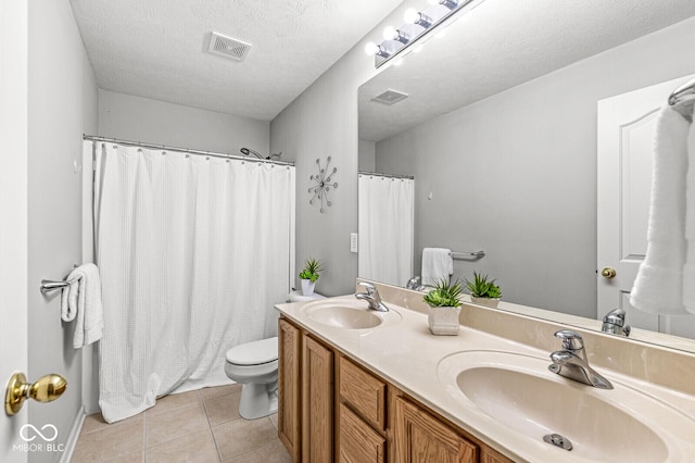 14353 Chariots Whisper Dr, Carmel, IN 46074 - bathroom with toilet, double vanity, tile patterned floors, a shower with shower curtain, and a textured ceiling