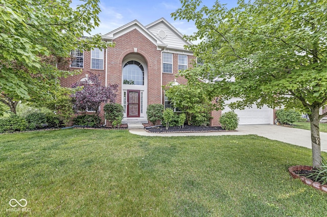14353 Chariots Whisper Dr, Carmel, IN 46074 - view of front facade with driveway, a front yard, and brick siding