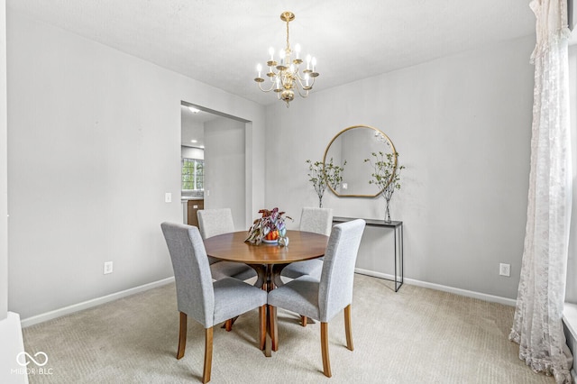 14353 Chariots Whisper Dr, Carmel, IN 46074 - dining room featuring a chandelier, light colored carpet, and baseboards
