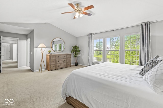 14353 Chariots Whisper Dr, Carmel, IN 46074 - carpeted bedroom featuring baseboards, lofted ceiling, and a ceiling fan
