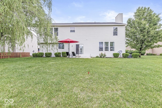 14353 Chariots Whisper Dr, Carmel, IN 46074 - back of property with a yard and a chimney