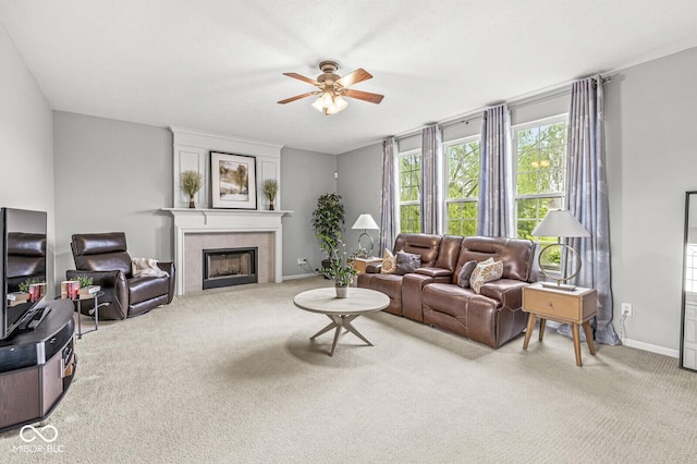 14353 Chariots Whisper Dr, Carmel, IN 46074 - carpeted living area with ceiling fan, a tile fireplace, and baseboards