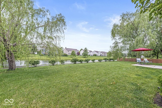 14353 Chariots Whisper Dr, Carmel, IN 46074 - view of yard with a water view, a patio area, and a residential view