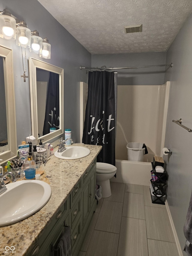 2248 Salem Park Dr, Indianapolis, IN 46239 - full bathroom featuring shower / tub combo with curtain, double vanity, toilet, and a textured ceiling