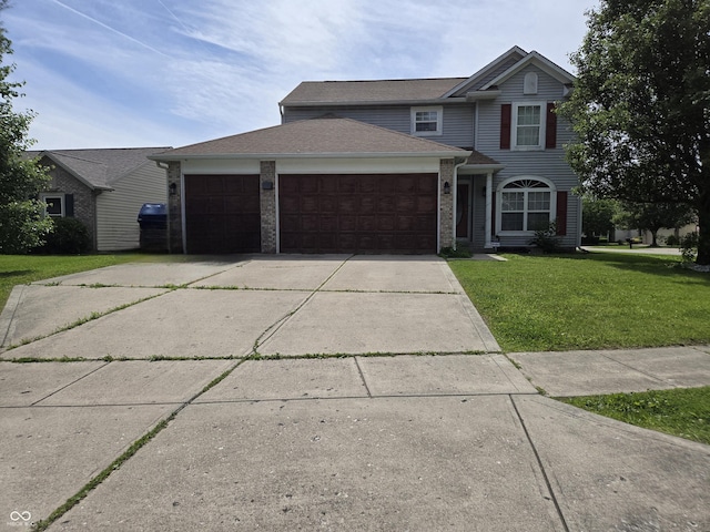 2248 Salem Park Dr, Indianapolis, IN 46239 - traditional-style home featuring a garage, a front yard, concrete driveway, and brick siding