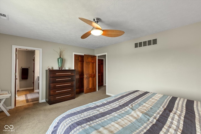 101 Edgewater Dr, Noblesville, IN 46062 - bedroom with light colored carpet, baseboards, a ceiling fan, and a textured ceiling