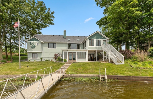 101 Edgewater Dr, Noblesville, IN 46062 - back of house featuring a sunroom, stairway, a chimney, a water view, and roof with shingles