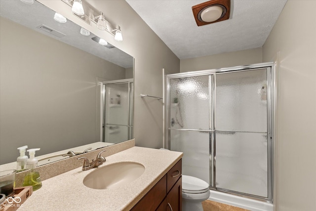 101 Edgewater Dr, Noblesville, IN 46062 - bathroom with vanity, a stall shower, toilet, and tile patterned flooring