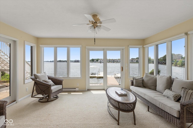 101 Edgewater Dr, Noblesville, IN 46062 - sunroom with a baseboard radiator, carpet, a water view, and baseboards