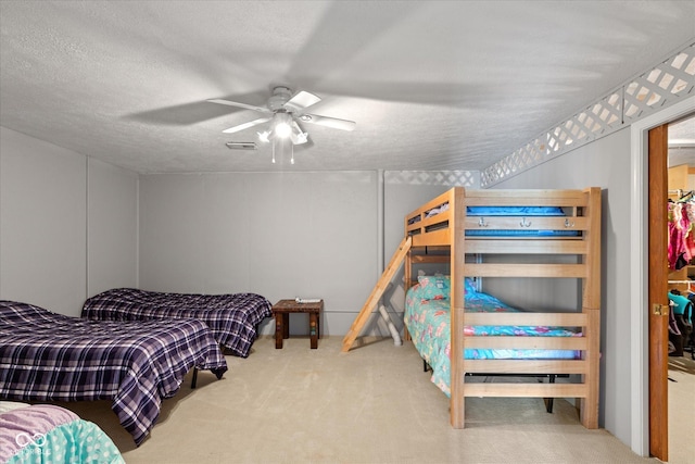 101 Edgewater Dr, Noblesville, IN 46062 - bedroom featuring carpet flooring, a ceiling fan, and a textured ceiling