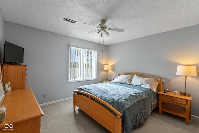 101 Edgewater Dr, Noblesville, IN 46062 - bedroom featuring light carpet, baseboards, a ceiling fan, and a textured ceiling