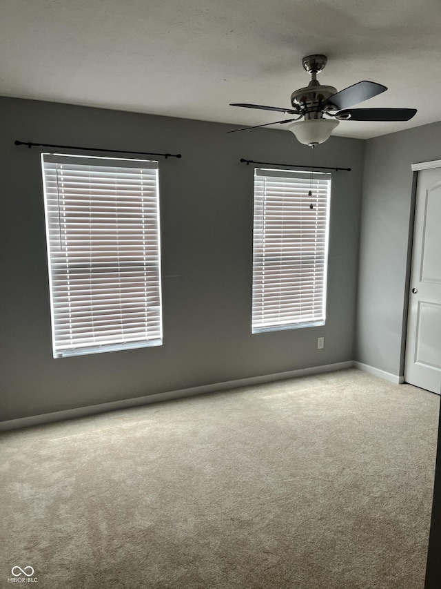 842 Westpointe Dr, Shelbyville, IN 46176 - empty room with a ceiling fan, carpet flooring, and baseboards