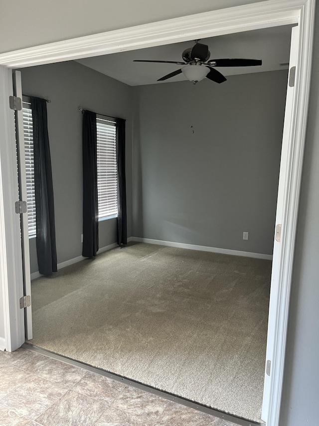 842 Westpointe Dr, Shelbyville, IN 46176 - empty room with carpet flooring, a ceiling fan, and baseboards